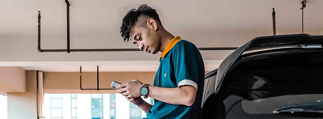 Car owner receiving SMS marketing message on smartphone